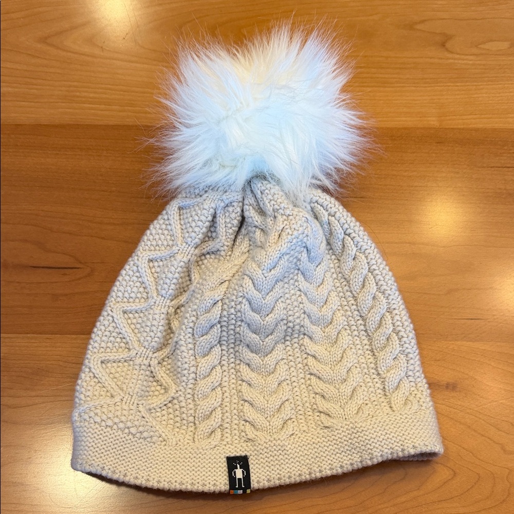 Smartwool Cream Cable Knit Beanie with White Pom-Pom.